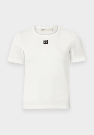 White ribbed short-sleeve T-shirt featuring a square black logo accent on the chest; round neckline, fitted shape, and soft texture.