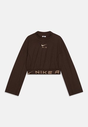 Brun cropped langærmet top lavet af blødt stof med lille guld Nike-logo og "AIR"-tekst på brystet samt en kontrastfarvet linning.