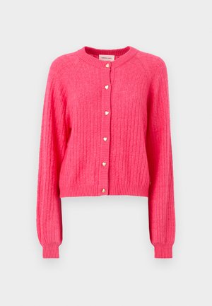 Fuchsia cropped cardigan with ribbed texture, round neckline, and heart-shaped golden buttons down the front. Long sleeves with ribbed cuffs.