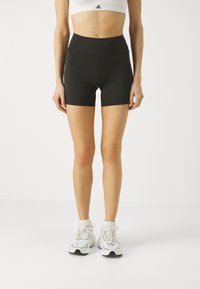 Schwarze Sportshorts mit hohem Bund, aus dehnbarem Stoff, mit Seitentaschen und einem eleganten Design.
