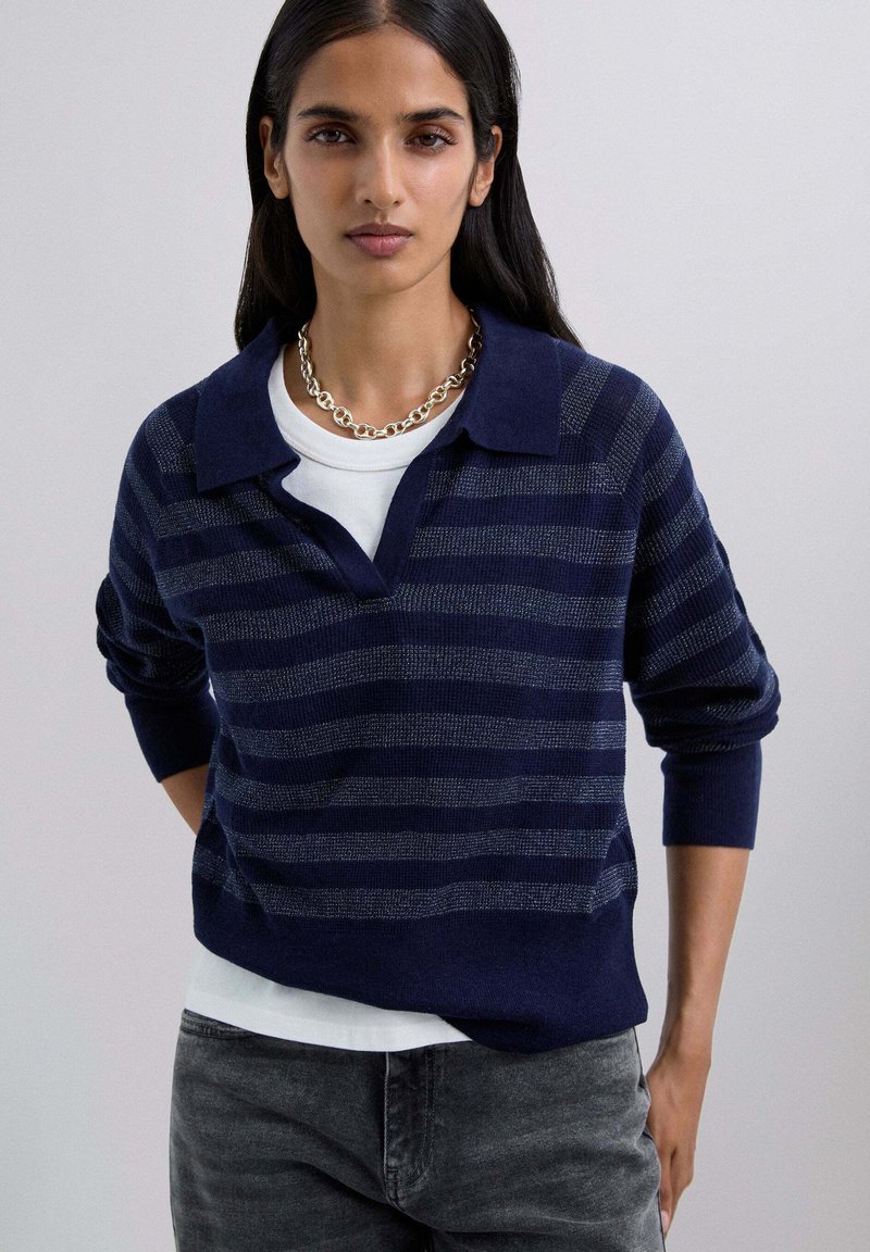Navy striped pullover sweater with a collared neckline and long sleeves. Features a textured pattern with contrasting light stripes.