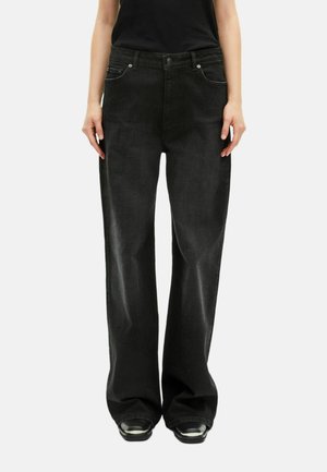 Zwarte broek met wijde pijpen en een gestructureerde fit, voorzien van een klassieke vijf-pocketstijl en hardware in zilvertint. Gemaakt van zacht denimstof.