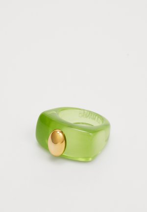 Green translucent resin ring with a smooth finish, featuring an oval gold accent on one side. Round inner shape for wear.