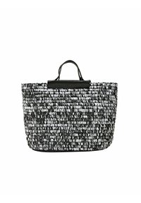 Sac de plage en paille tissée noir et blanc, de forme rectangulaire, avec une finition texturée et un accent en cuir noir sur le dessus.