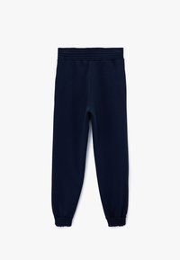 Marineblå sweatpants i blødt materiale med elastisk talje og sammensnørrede manchetter for en behagelig, smal pasform.