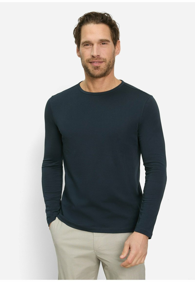 Navyfarbendes Langarm-T-Shirt aus weichem Stoff, mit rundem Halsausschnitt und taillierter Silhouette. Minimalistisches Design ohne Muster oder Akzente.