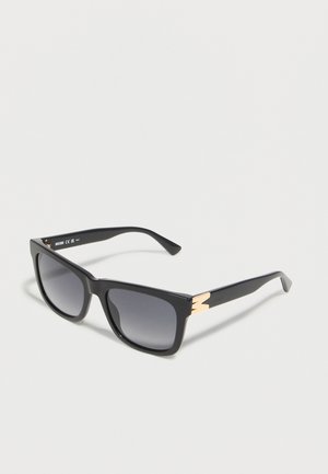 Black rectangular sunglasses with gradient dark lenses and gold decorative accents on the temples, set against a plain light background.