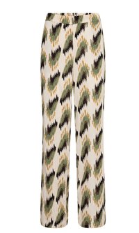 Patterned pants with a wide-leg design, featuring a cream background and abstract green, black, and yellow motifs. Made of lightweight fabric.
