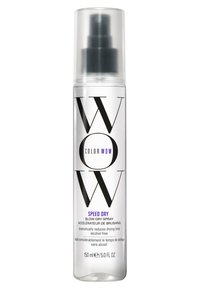 Color Wow Speed Dry Föhn Spray in een doorzichtige kunststof fles met een pompdispenser. Het etiket heeft vetgedrukte zwarte tekst en paarse accenten, 150 ml.