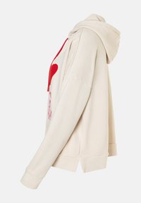 Beige hoodie with a front heart graphic, red accents, and a relaxed fit. Features a drawstring hood and ribbed cuffs.