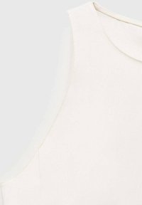 White sleeveless blouse with a rounded neckline, smooth texture, and understated stitching detail along the armhole and neckline.