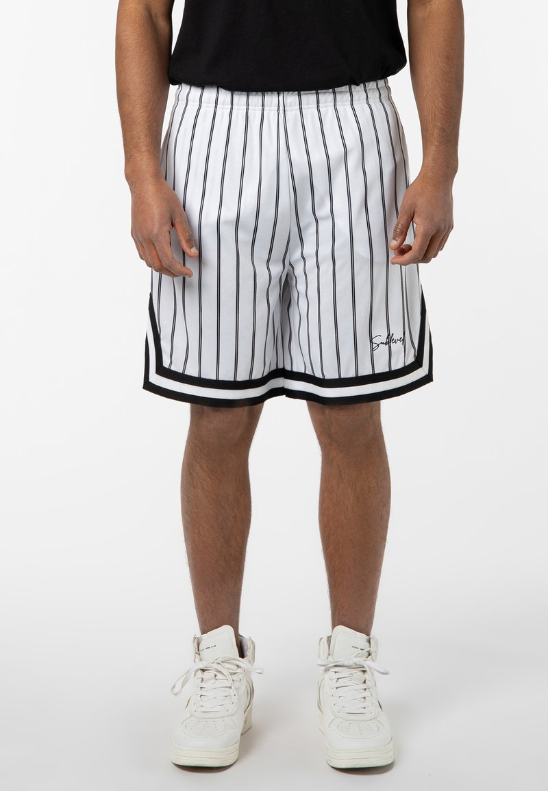 White basketball shorts with black vertical stripes, an elastic waistband, black hem accents, and a logo on the lower left side.