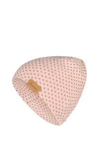 Light pink knit beanie with small dark dots pattern and a tan rectangular leather label stitched on the side.