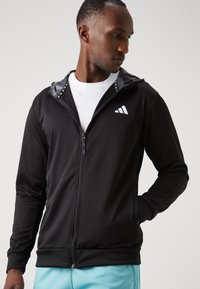 adidas Performance TRAIN ESSENTIALS CAMO FULL ZIP - Chaqueta de entrenamiento - black