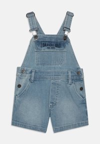 Salopette in denim azzurro chiaro, con bretelle regolabili, tasca frontale con logo "Timberland" e due tasche laterali.