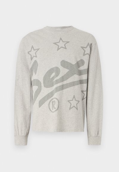 Gray long-sleeve t-shirt featuring large gray "Sex" text and star graphics. Soft cotton material with fitted cuffs and a round neckline.