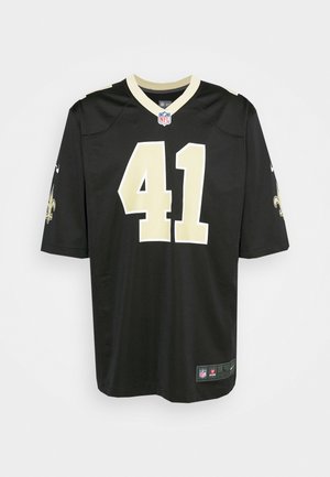 Czarny jersey New Orleans Saints NFL z numerem 41 w kolorze złotym, logo NFL na kołnierzu i logo fleur-de-lis drużyny na rękawach.