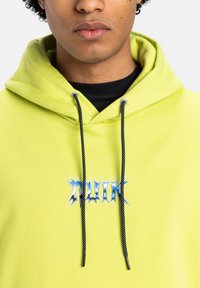 Lime green hoodie with black drawstrings, featuring a blue graphic print in a jagged font on the front. Soft, textured fabric.
