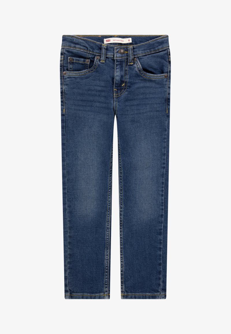 Džíny z tmavě modrého denimu s úzkým střihem. Mají pět kapes, žluté šití a zip s knoflíkovým zapínáním.