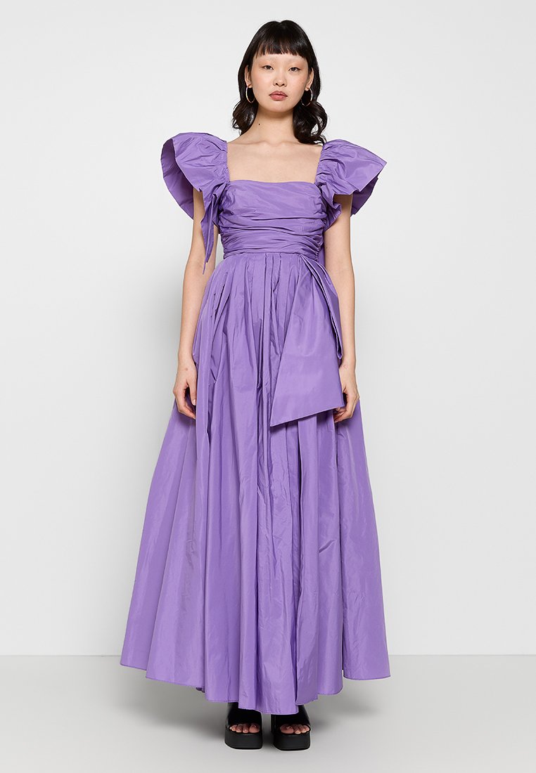 Purple evening gown featuring puff sleeves, a square neckline, sash detailing at the waist, and a full, gathered skirt. Smooth texture.