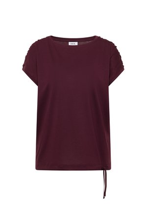 Top manches courtes de couleur bordeaux foncé avec encolure ronde, détails froncés sur les manches et cordon de serrage ajustable à l'ourlet.