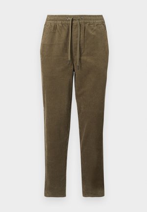 Olijfgroene corduroy broek met een elastische tailleband en trekkoord. Heeft een verticale ribbeltextuur en een taps toelopende pasvorm.