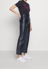 COACH Camiseta estampada - black