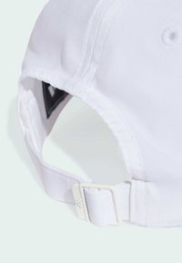 White adjustable baseball cap with a smooth fabric texture, featuring a curved brim and a plastic buckle strap at the back.