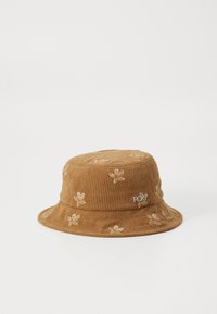 Bruine corduroy bucket hat met een bloemenborduursel en een zilveren Roxy-logo aan de zijkant. Zachte textuur, ronde kroon, bredere rand.