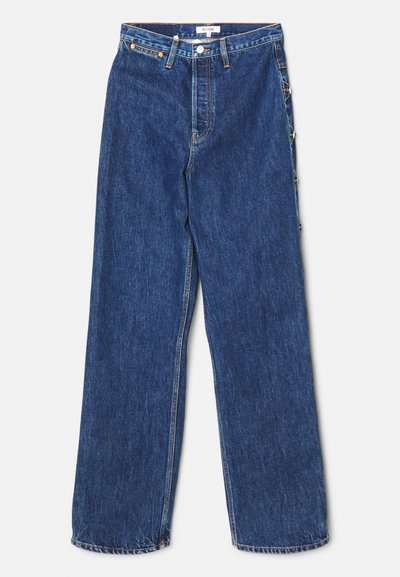 Dark blue denim jeans with a straight-leg cut, five-pocket design, and button-fly closure. Features metal hardware and visible stitching.