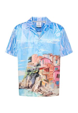 Short-sleeve shirt in light blue with a coastal scene featuring colorful buildings. Fabric has a smooth texture and button-up design.