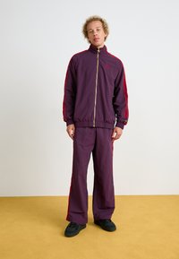 Puma T7  PLAY.LOUD. TRACK - Chaqueta de entrenamiento - midnight plum