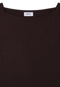 Haut sans manches marron foncé avec larges bretelles et une étiquette blanche indiquant le nom de la marque "CECIL" à l'encolure.