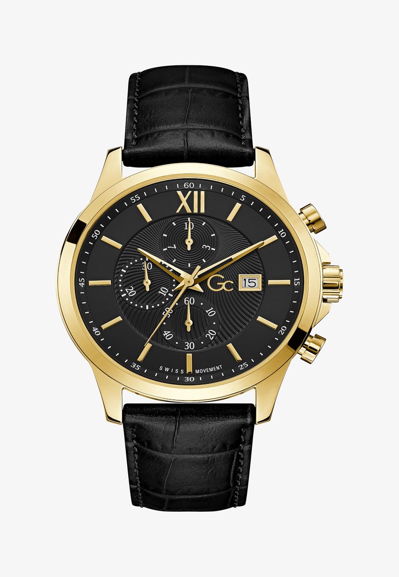 Zelta tonis rokas pulkstenis ar melnu ciparnīcu, reljefu tekstūru un diviem subciparnīcām. Melnas ādas siksna ar krokodila rakstu. Datuma displejs pulksteņa 3 stundu pozīcijā.