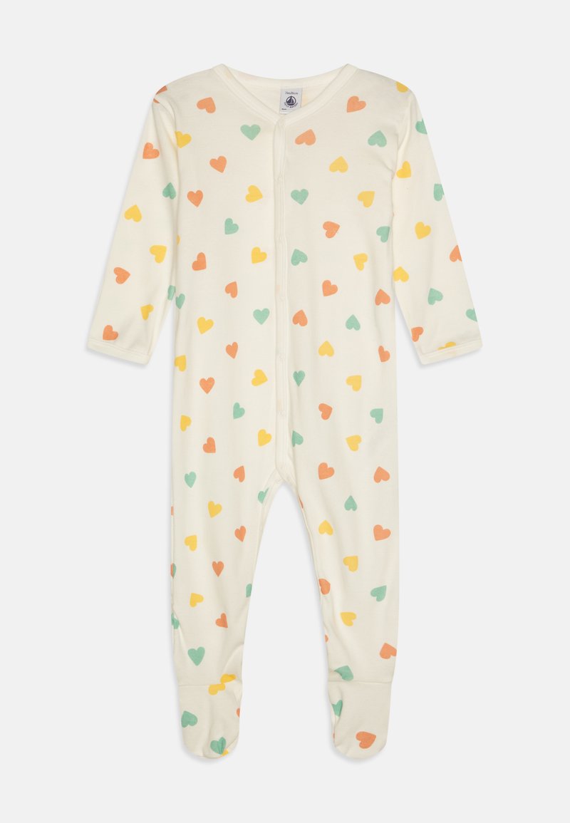 Krém színű pamut kezeslábas, apró, zöld, narancs és sárga szív mintával. Hosszú ujjakkal és talpas lábakkal rendelkezik.