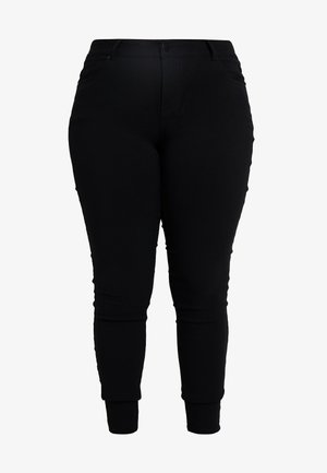 Svarta tajta byxor i elastisk tyg, med en slät yta, avsmalnande ben och midjehögt midjeband med framfickor.