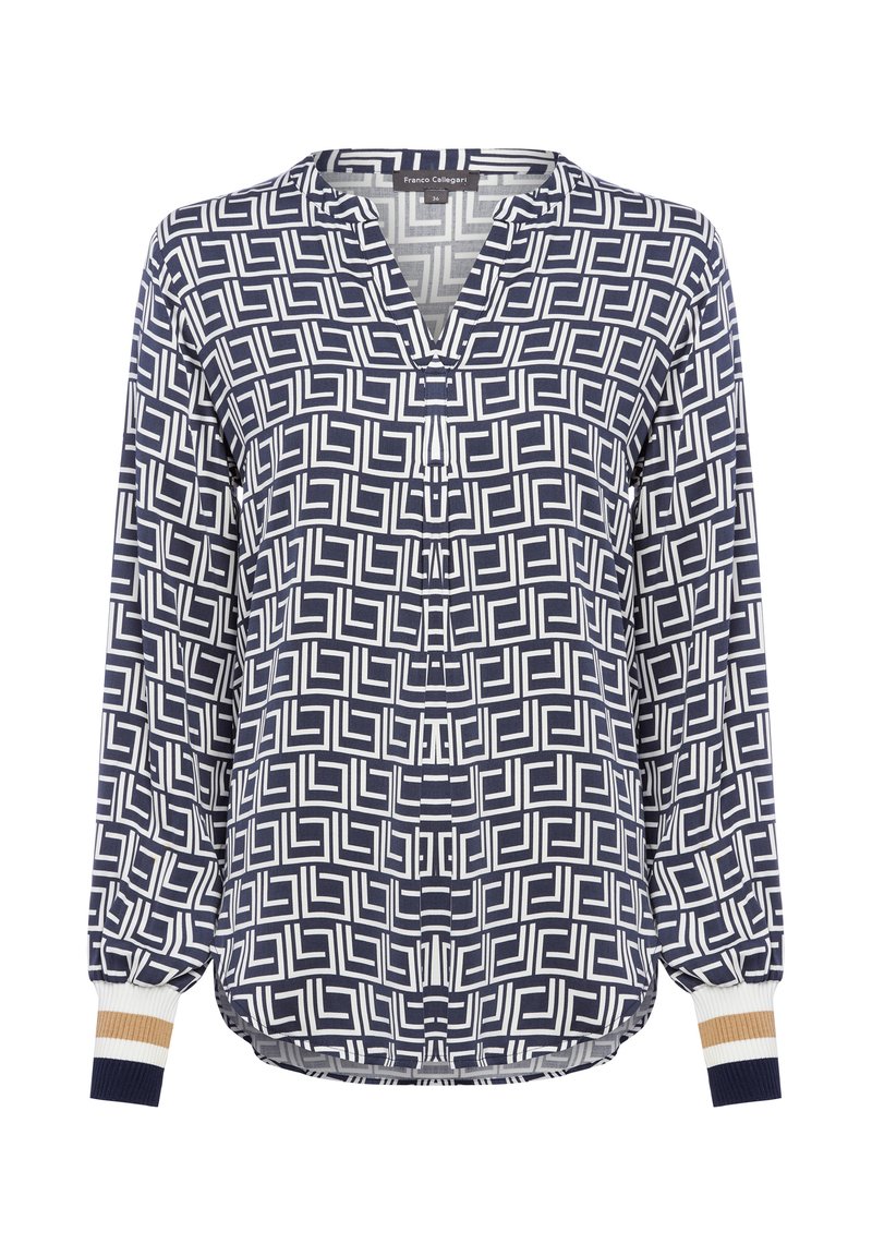 Blusa navy e bianca con motivo geometrico, scollo a V e maniche elasticizzate con dettagli a strisce beige e navy.