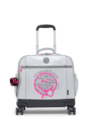 Gray rolling suitcase with telescopic handle, front zipper pocket, pink graffiti smiley face, and small doll keychain on side.