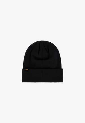Black knit beanie with a folded cuff and a small rectangular tag featuring a yellow star logo on the side.