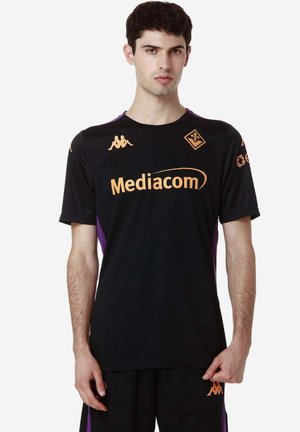 Black sports jersey with purple accents, featuring a round neck, short sleeves, and orange branding for Mediacom and Kappa. Textured fabric.