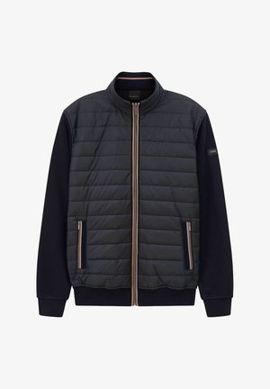 Gepolsterte schwarze Jacke mit durchgehendem Reißverschluss, geripptem Kragen und kontrastierenden dunklen Ärmeln. Verfügt über Reißverschlusstaschen und dezente hellbraune Akzente.