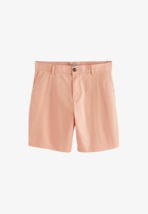 Shorts pour hommes de couleur rose clair avec fermeture à boutons, passants pour ceinture et poches latérales sur fond blanc.
