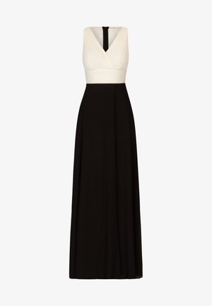 Bodenlanges Kleid mit einem weißen gerafften Oberteil und einem einfarbigen schwarzen Rock. V-Ausschnitt-Design mit einem schwarzen Reißverschluss hinten. Glatter Stoff.