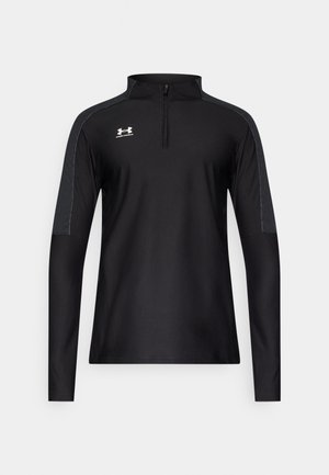 Crna sportska majica s dugim rukavima, četvrtastim patentnim zatvaračem, kontrastnim sivim detaljima na ramenima i malenim bijelim logotipom na prsima.