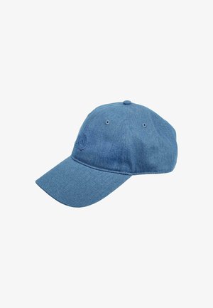 Blue denim baseball cap with a curved brim, textured fabric, embroidered logo on the front, and ventilation eyelets on the sides.