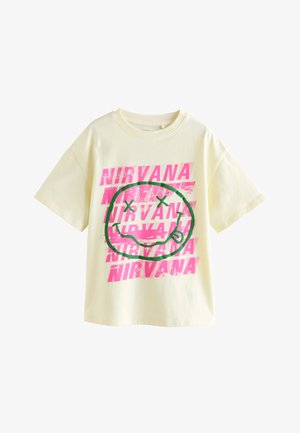 Krém színű rövid ujjú póló neon rózsaszín "Nirvana" felirattal, és egy nagy zöld mosolygós logóval, keresztbe tett szemekkel.