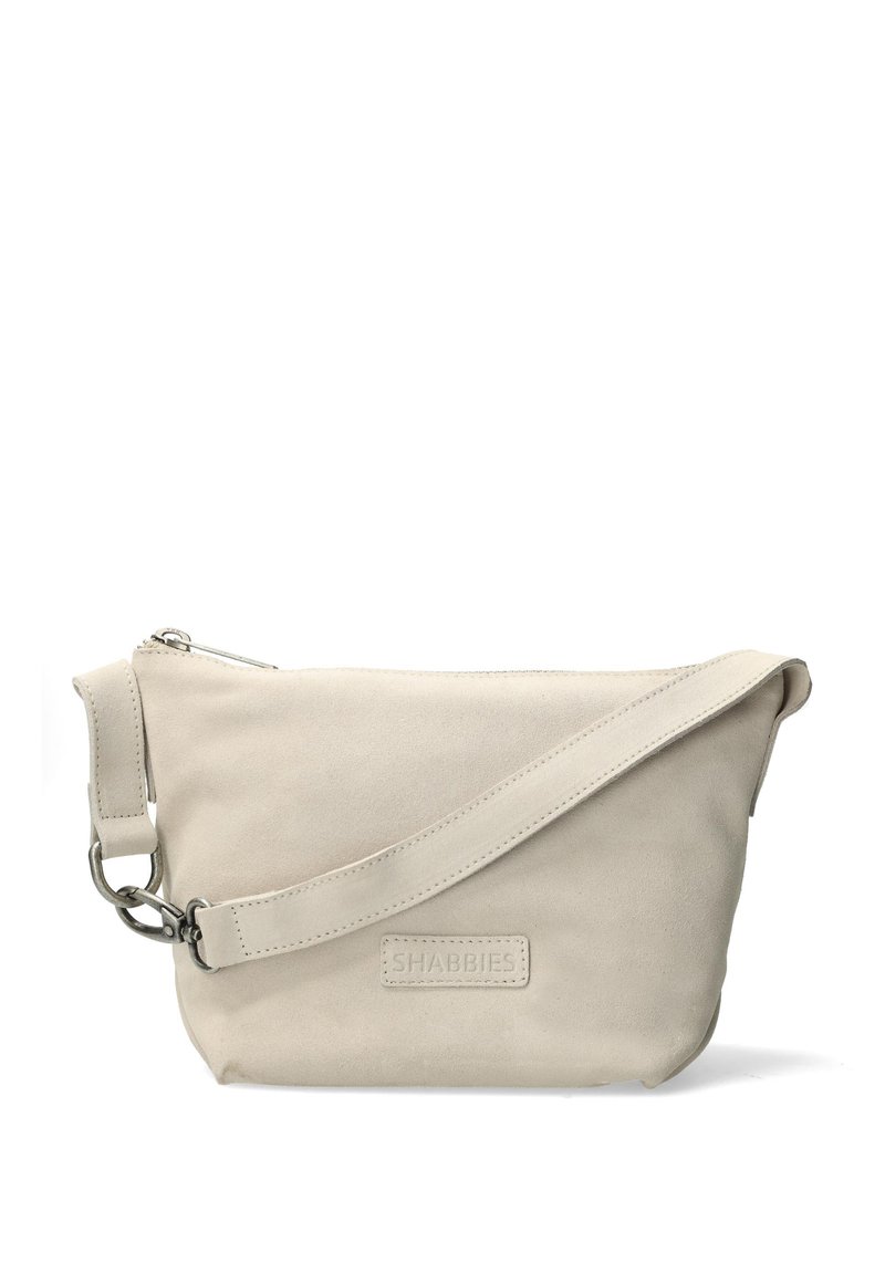 Borsa a tracolla in suede beige con tracolla regolabile, chiusura a zip e etichetta con logo. Finitura liscia, design minimalista e senza motivi visibili.