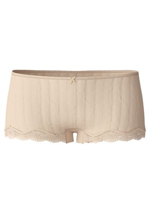 Beige tanga-alushousut, joissa on poimuttunut pinta, pitsireunus alaosassa ja pieni nauhakoriste etuosassa.