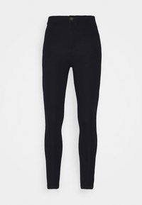 Leggings negros hechos de tejido elástico. Diseño de talle alto con cierre de botón. Textura suave y forma ajustada. Sin patrones ni adornos.
