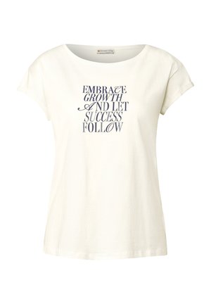 T-shirt en coton blanc avec un encolure large et des manches courtes, arborant un texte bleu marine : « EMBRASSER LA CROISSANCE ET LAISSER LE SUCCÈS SUIVRE. »